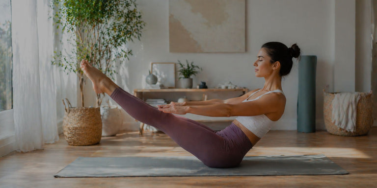 Woman practicing yoga in a home setting with plants and decor.